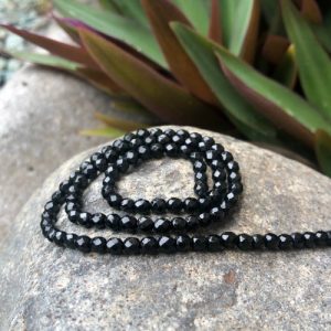 blackonyxfaceted4mmroundbeads4 black onyx faceted 4mm round gemstone beads
